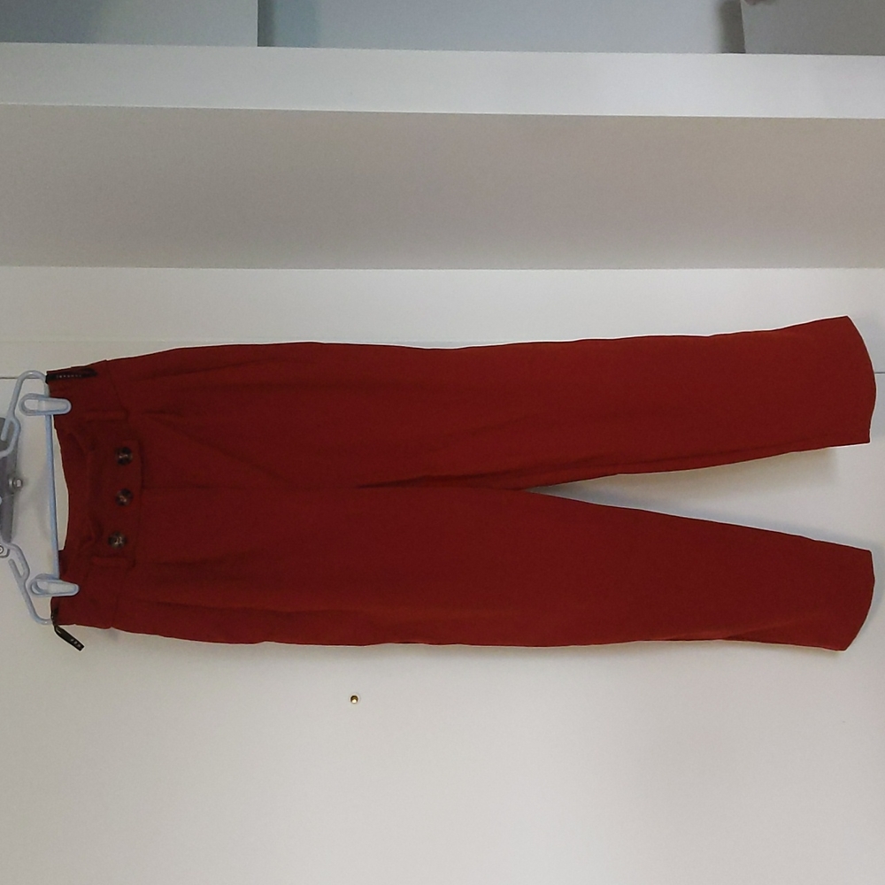 Topshop brick red trousers with tortoiseshell buttons, size 4.